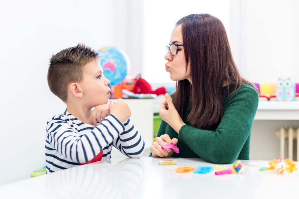 Boy in speech therapy with speech therapist